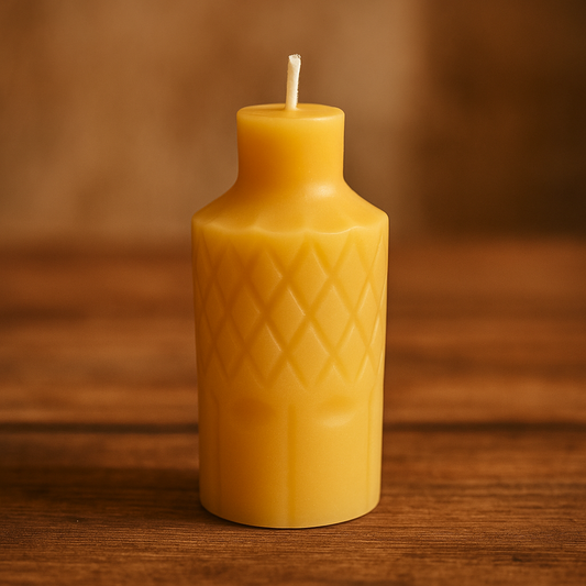 Lit diamond patterned beeswax candle with round neck on rustic table – handmade, eco-friendly, natural honey aroma.