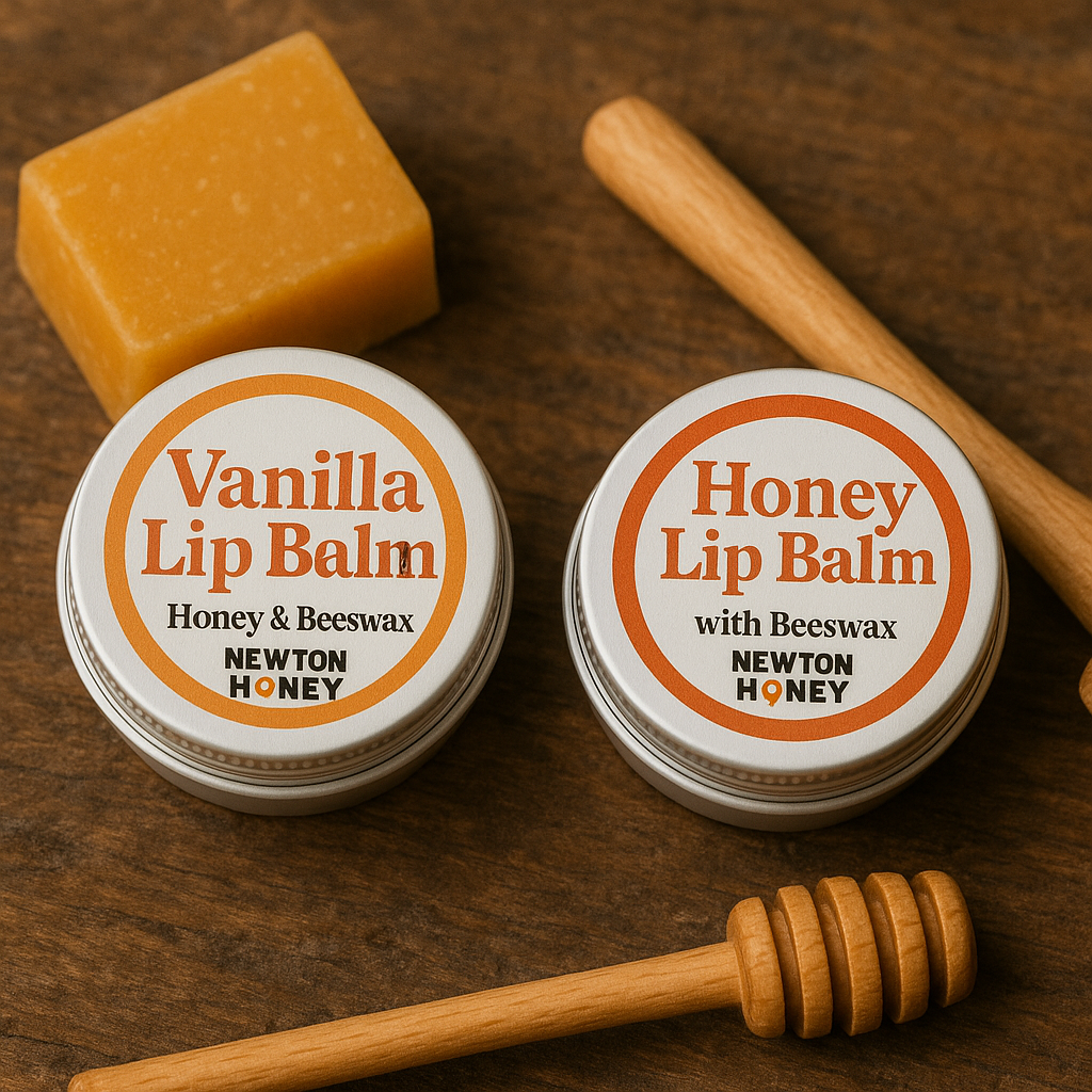 Two tins of Newton Honey Lip Balm in Vanilla and Honey flavours, with natural beeswax and honey dipper on rustic wood background