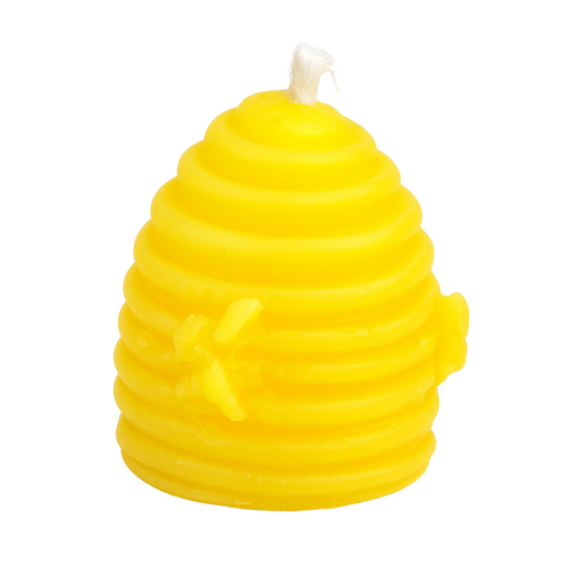 Yellow beehive-shaped candle on a white background