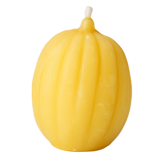 Handmade pumpkin beeswax candle on white background – eco-friendly, pure beeswax, natural honey scent, autumn and Halloween décor.