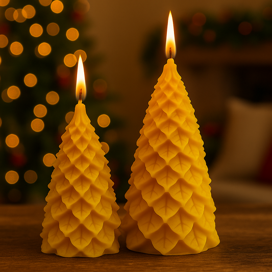 Two tree-shaped candles with a blurred festive background