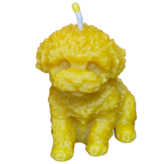 Handcrafted dog-shaped beeswax candle made from 100% pure beeswax.
