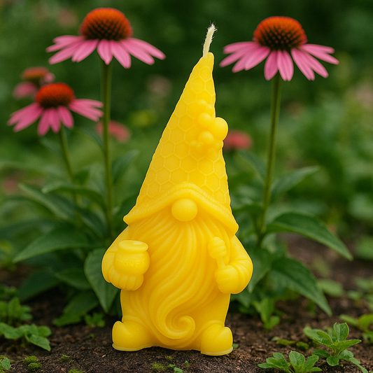 Yellow gnome-shaped candle in a garden with pink flowers in the background