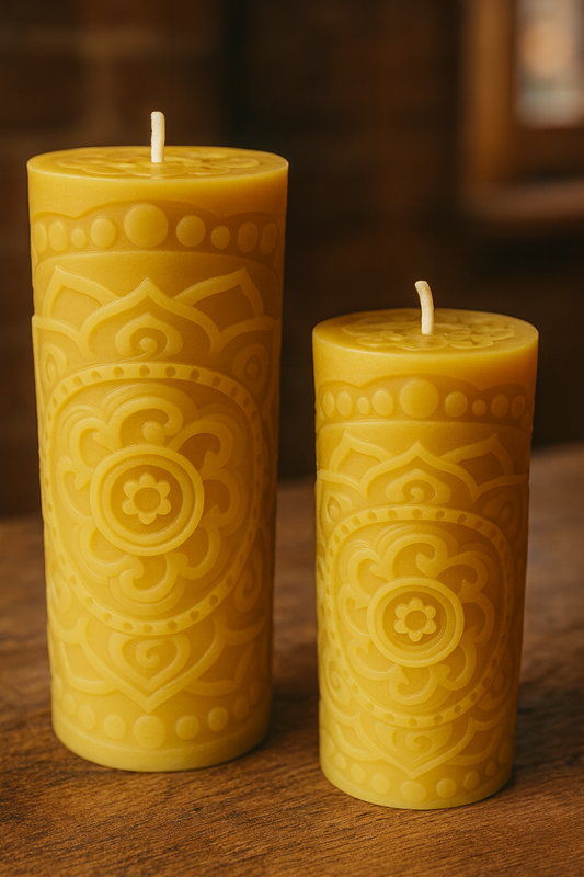 Pair of mandala patterned beeswax pillar candles showing large and small size options