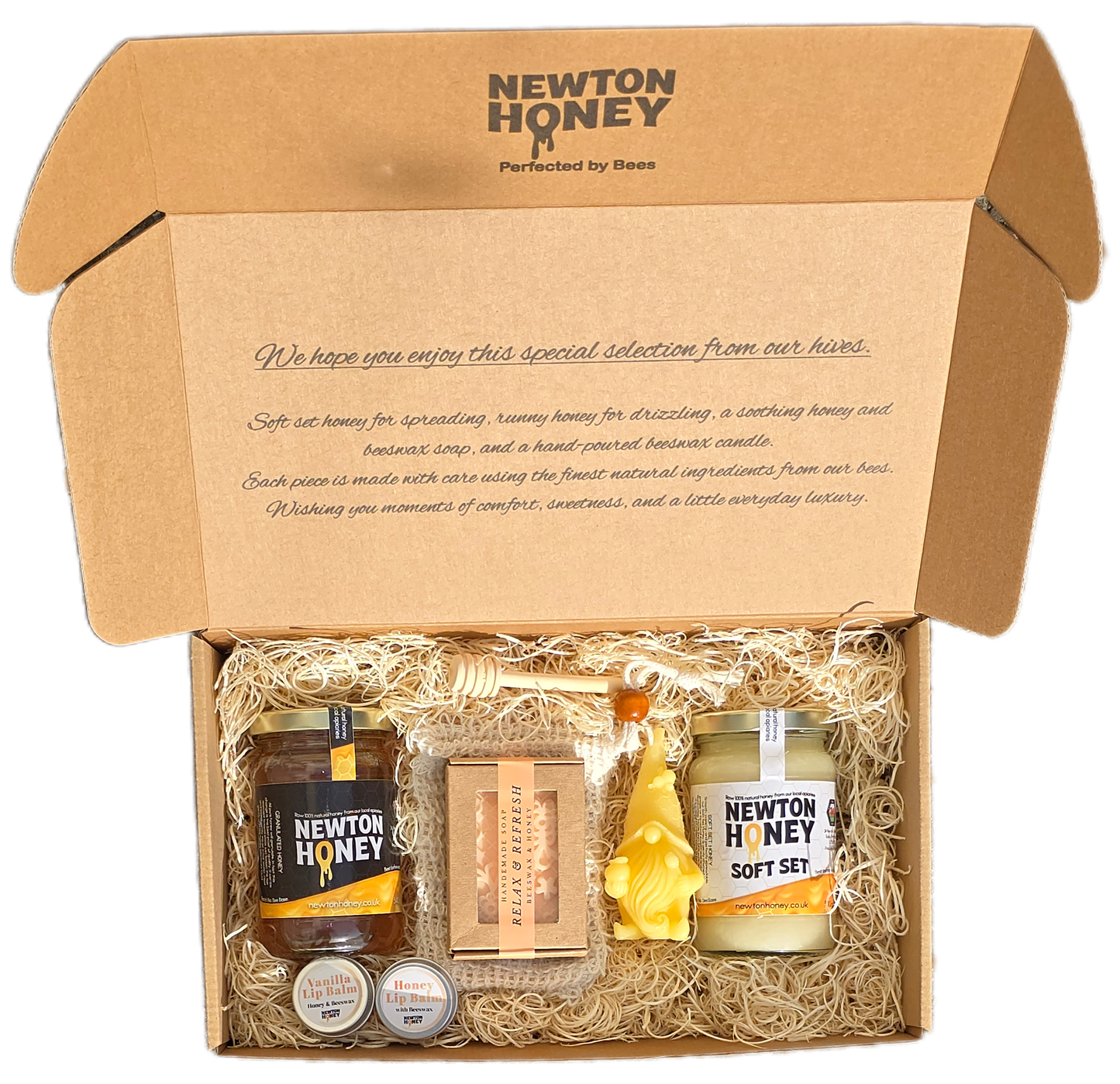 Newton Honey Luxury Gift Box featuring soft set and runny honey jars, handmade beeswax and honey soap, beeswax candle, and natural lip balms in an eco-friendly kraft presentation box