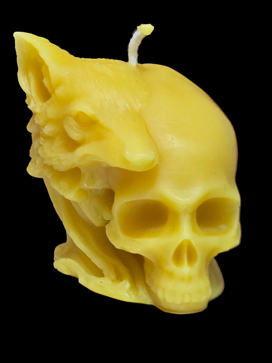 Bold handmade pure beeswax skull and wolf candle. A natural golden beeswax statement piece for gothic or alternative gifts.